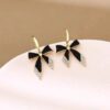Black bow dazzle earrings